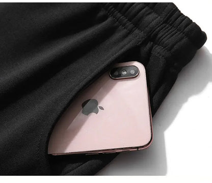 .A casual sports outfit consisting of a long-sleeved hooded t-shirt and elastic-waist pants.